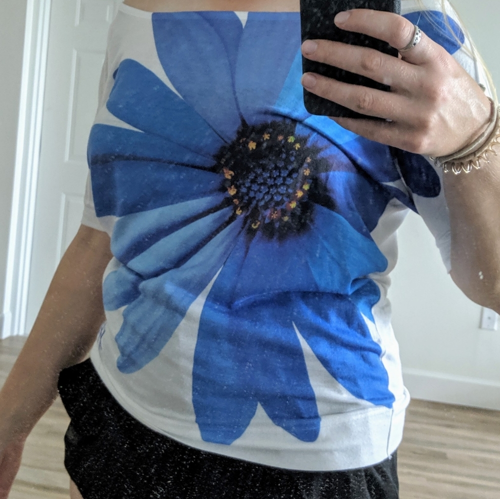 White dolman style shirt with big blue flower